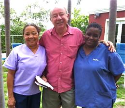 From left, Rhea Vasconcellos, Joe Aubain and senior kennel technician Phyllis Rogers at Saturday's work party.